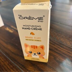 THE CREME SHOP HELLO KITTY MANGO FLUFF MOISTURIZING HAND CREAM 1.69 OZ